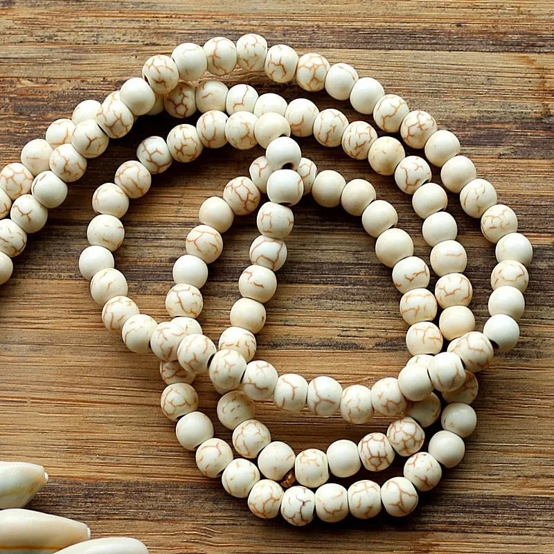 White Magnesite Beads with Cowry Shells and Silk Tassel | Erika Williner Designs