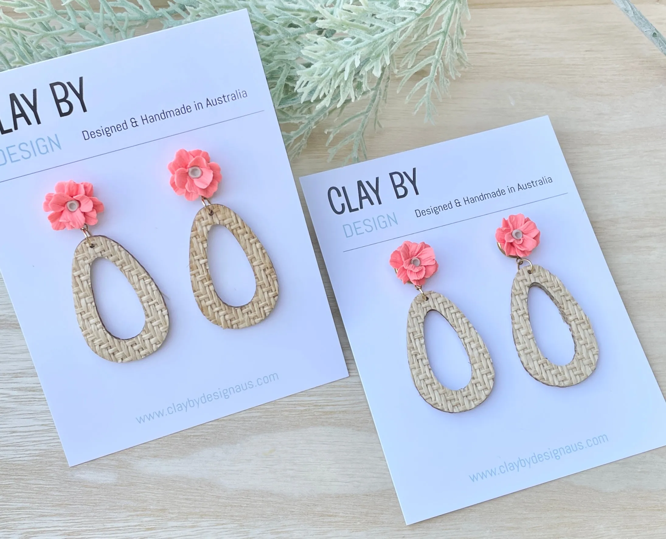 Woven drop with bright coral flower stud tops